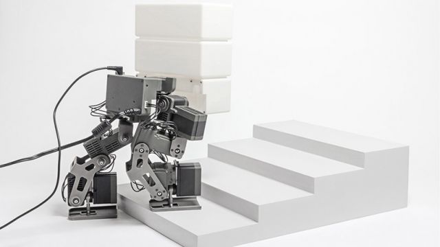 Robot prototypes carry and stack eco-friendly “Bio Bricks”. Photo courtesy of Paul Qaysi.