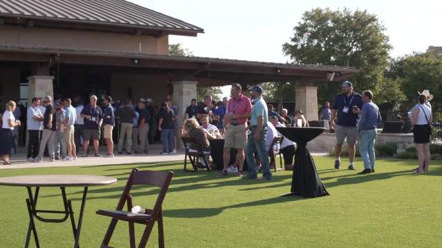 MCAA members gather outdoors at a Midyear event