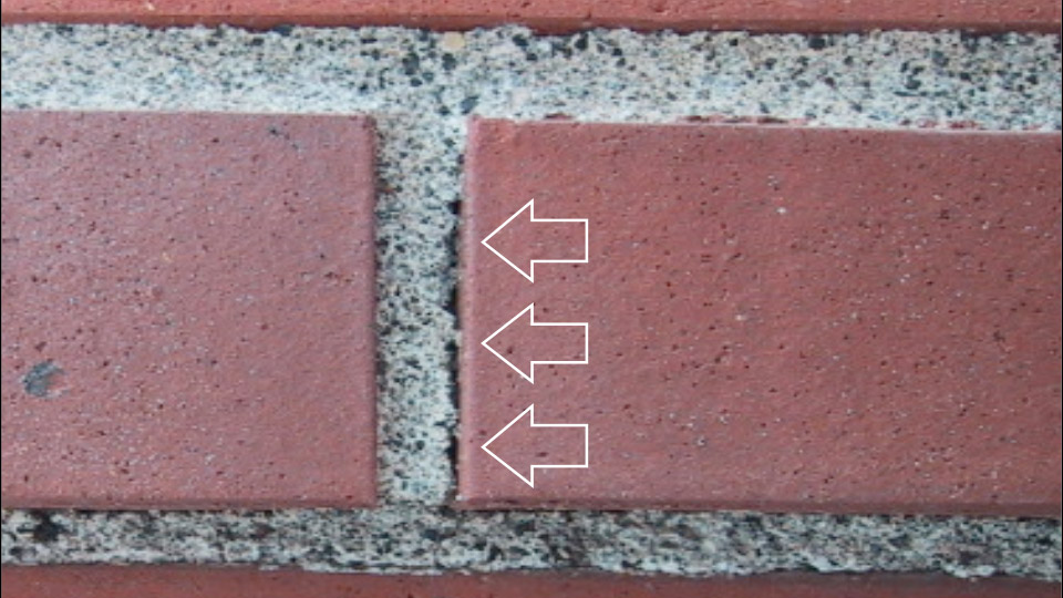 It is difficult to completely fill joints and get good bond with stiff mortar, as seen here. The separation between mortar and brick, known as a bond-line delamination, will let in water during driving rains.