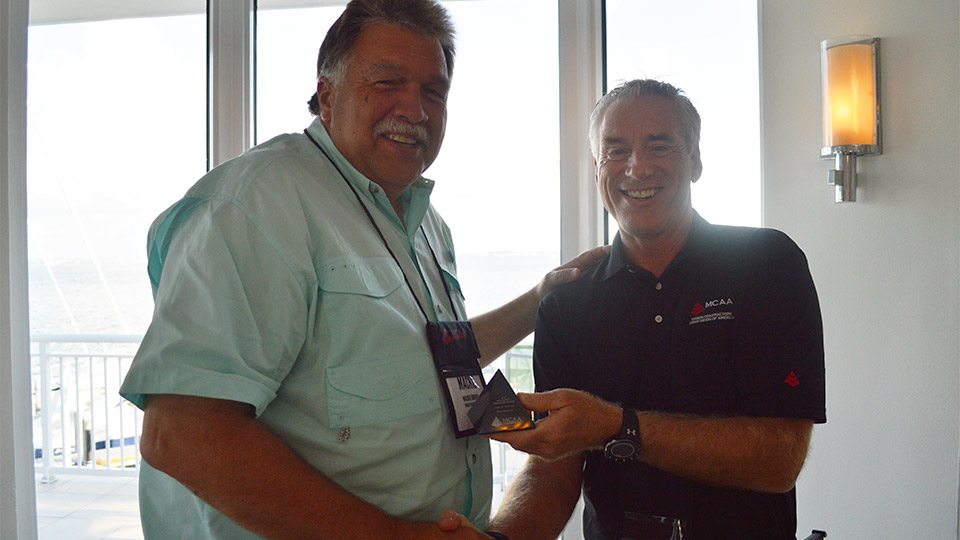 MCAA Chairman Mark Kemp (right) presents the second place MCAA Safety Advantage Award for Greater than 100,000 Hours to Mackie Bounds from Brazos Masonry, Inc.