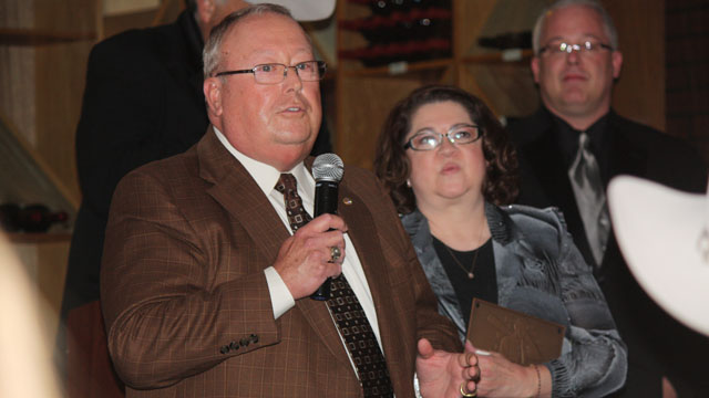 Robert V. “Buddie” Barnes, Jr. (left) and Deby Barnes (right) accept the inaugural Masonry Hall of Fame plaque on behalf of C. DeWitt Brown.