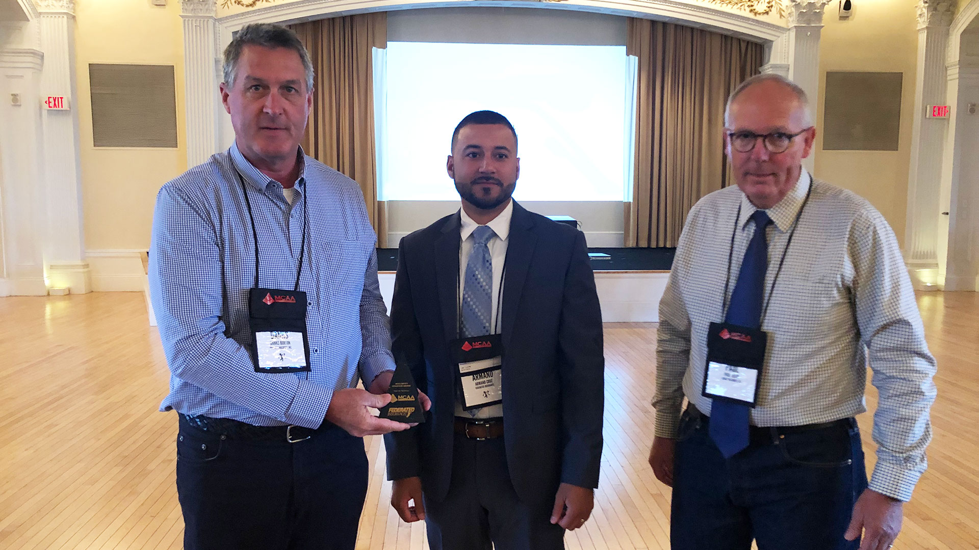 Danks Burton (left) is presented the MCAA Safety Advantage Award by Armand Cruz of Federated Insurance (center) with Paul Odom (right).