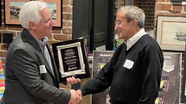 MCAA Vice Chairman Dick Dentinger awarding Mr. Felice his MCAA plaque